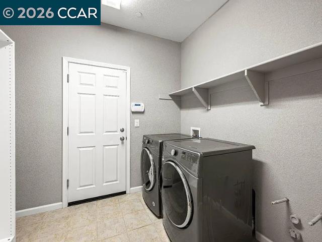 5525 Mossy Stone Way Rancho Cordova, CA 95742 - Photo 31 of 31 a utility room with dryer and washer