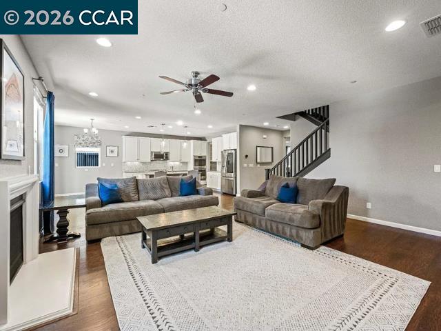 5525 Mossy Stone Way Rancho Cordova, CA 95742 - Photo 10 of 31 a living room with furniture and wooden floor