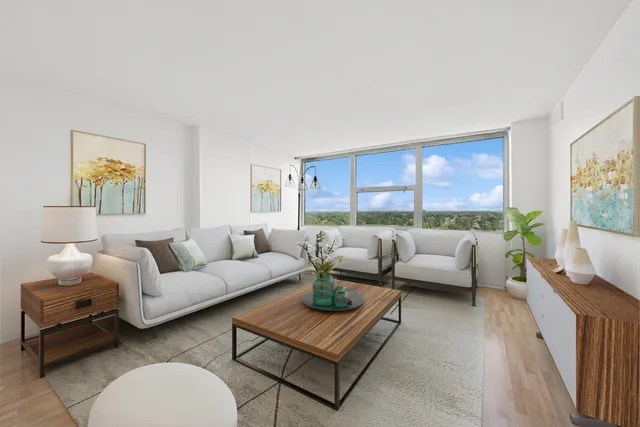 a living room with furniture and a large window