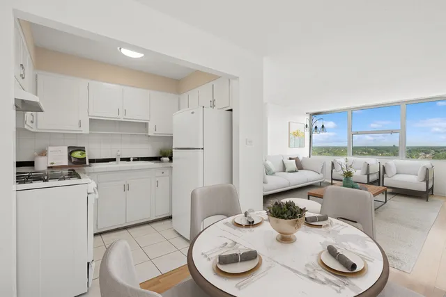 a living room with furniture and a kitchen island