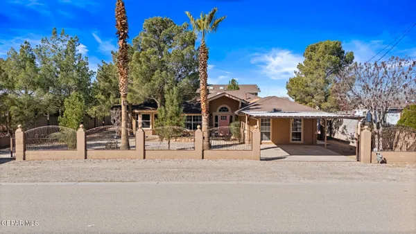 a front view of a house with a street