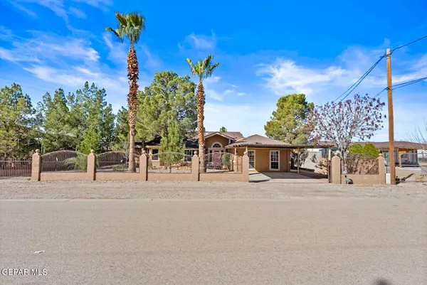 a kitchen with stainless steel appliances kitchen island granite countertop a sink stove and cabinets
