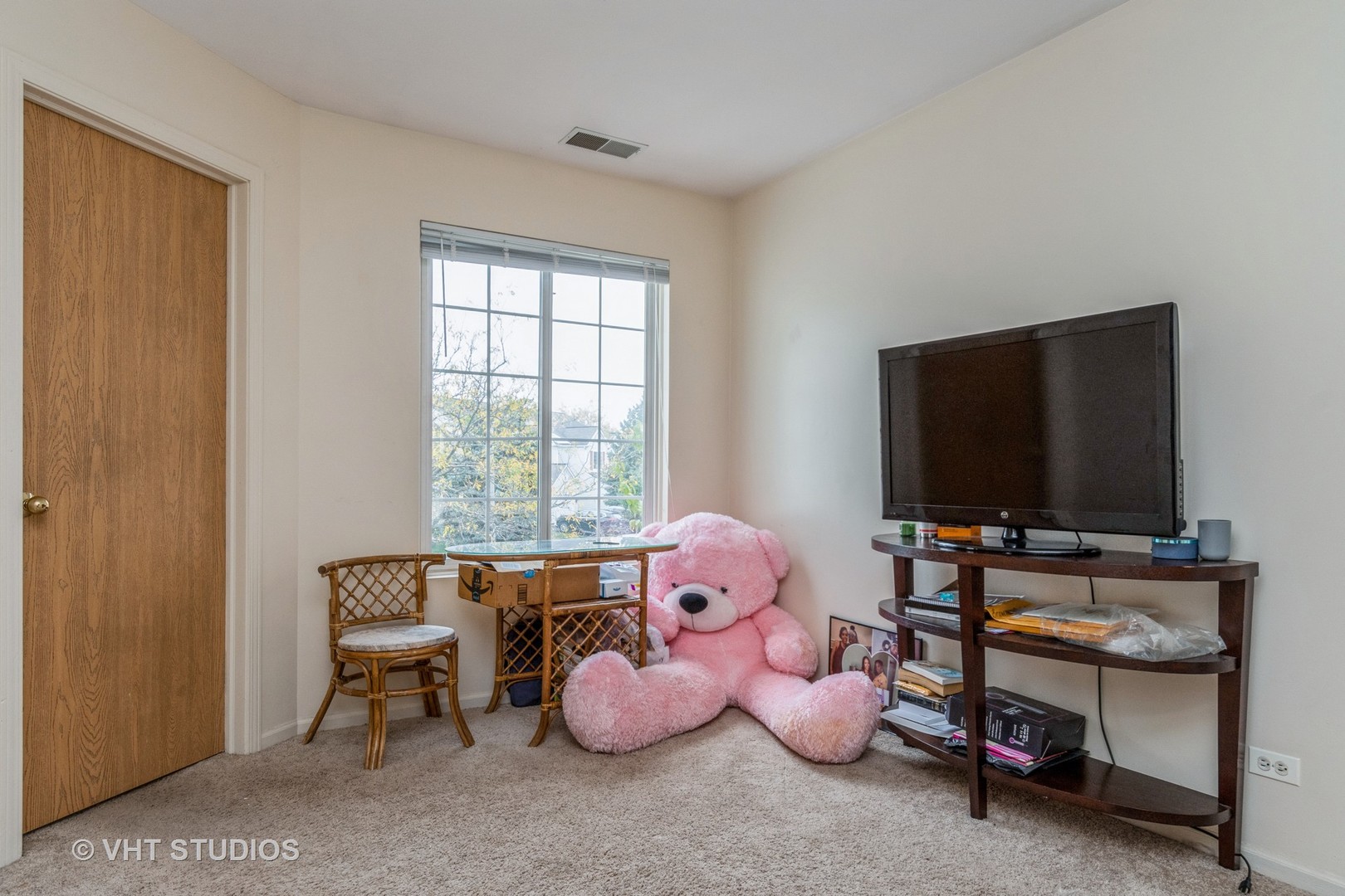 2613 Carrolwood Road Naperville, IL 60540 - Photo 5 of 11 a living room with furniture and a flat screen tv