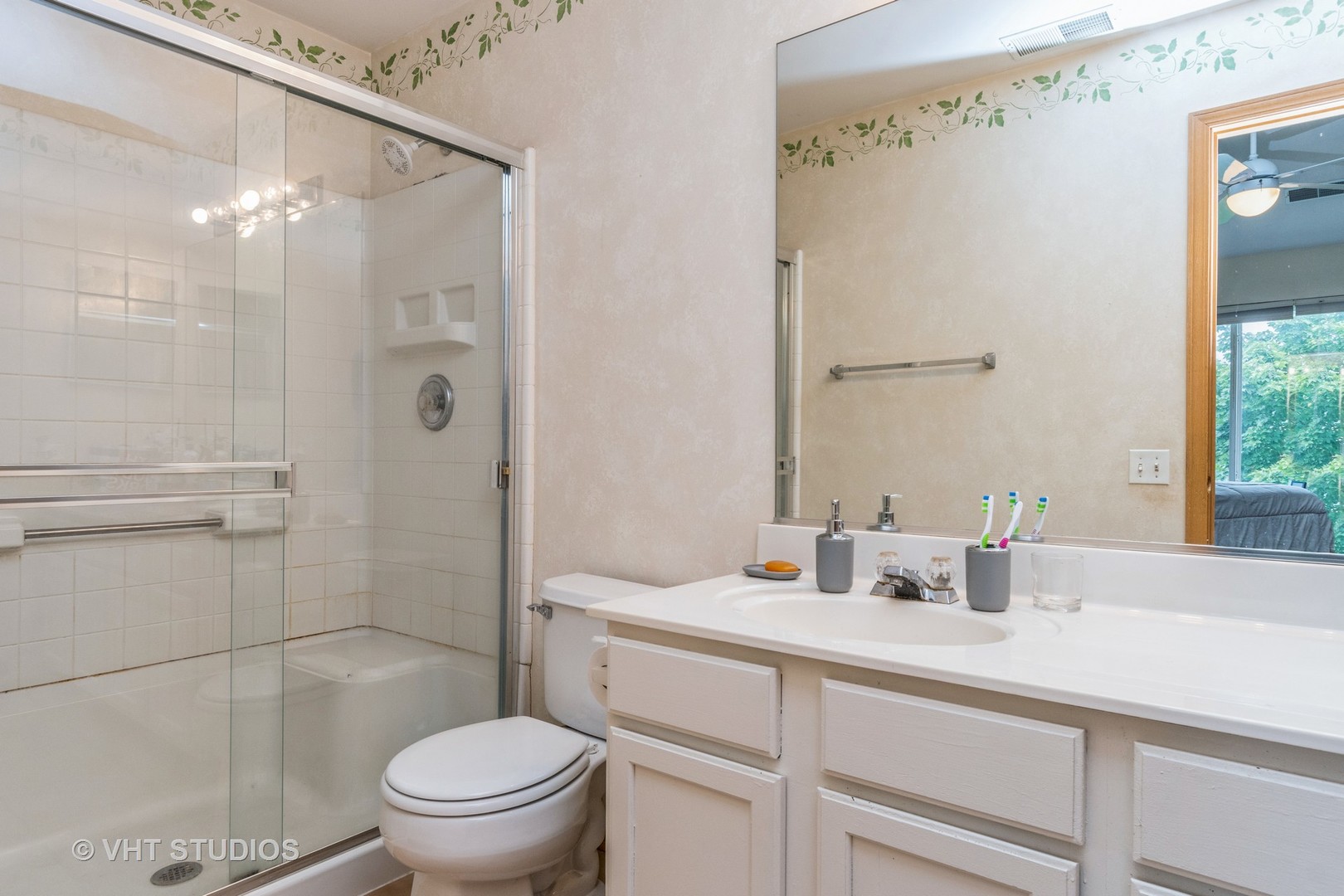 2613 Carrolwood Road Naperville, IL 60540 - Photo 7 of 11 a bathroom with a sink a toilet and shower