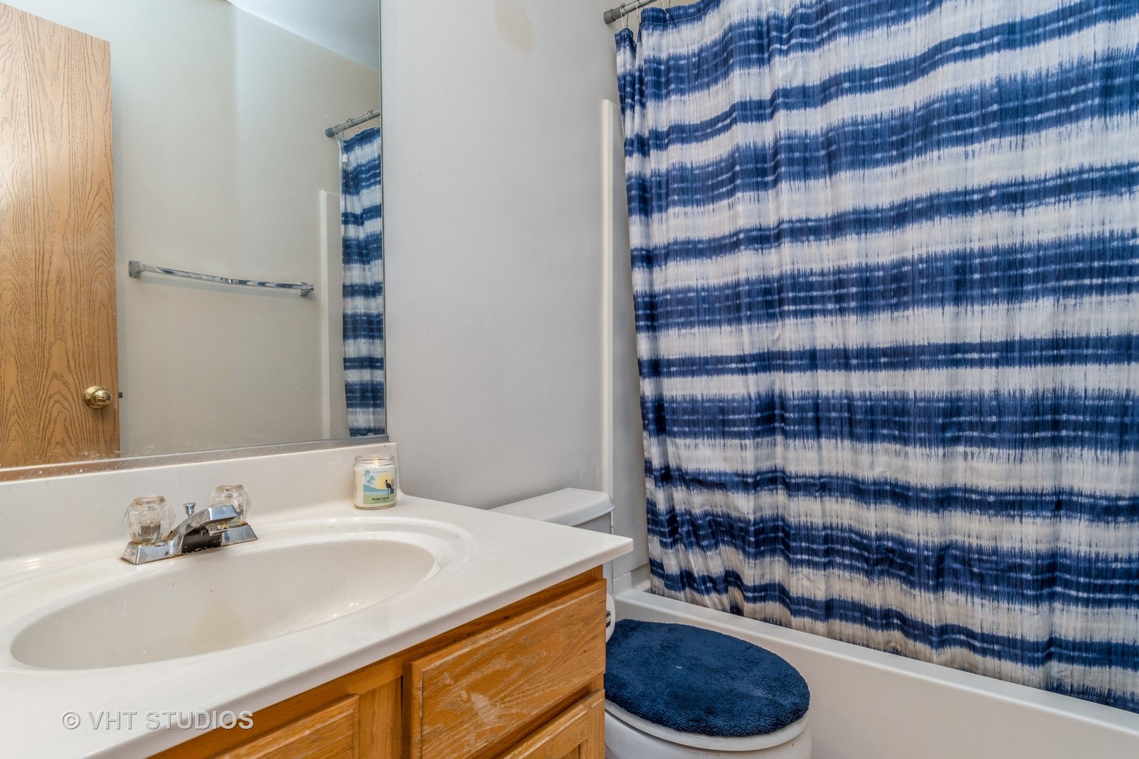 2613 Carrolwood Road Naperville, IL 60540 - Photo 8 of 11 a bathroom with a sink and a mirror
