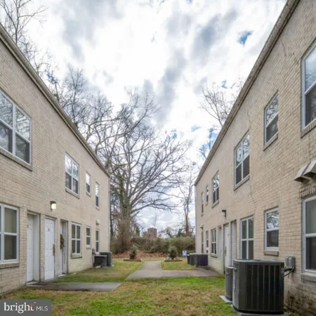 a view of a building with a yard
