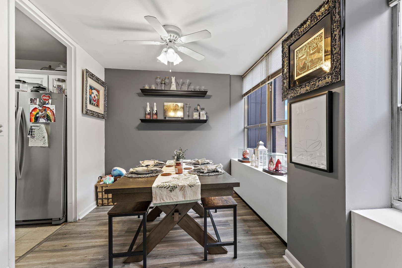 655 West Irving Park Road, Unit 515 Chicago, IL 60613 - Photo 4 of 22 a view of a dining room with furniture and chandelier