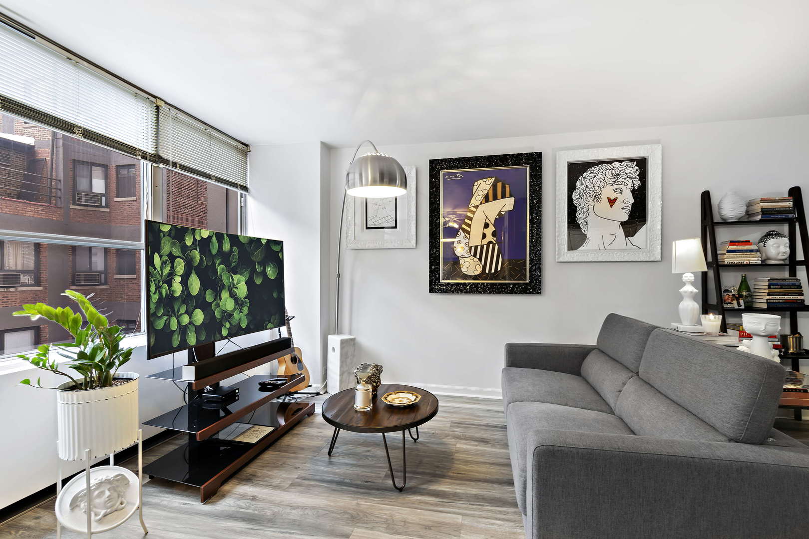 655 West Irving Park Road, Unit 515 Chicago, IL 60613 - Photo 6 of 22 a living room with furniture a rug and a painting on the wall