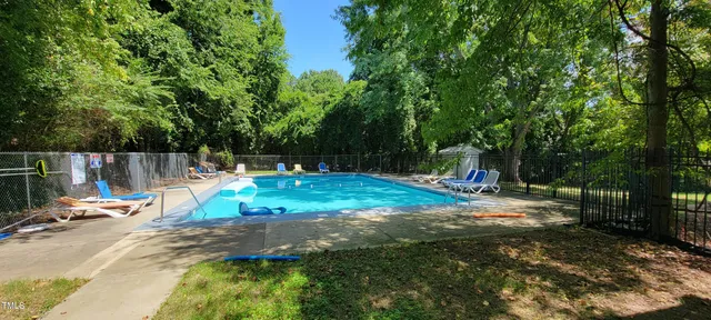 a view of a park with large trees