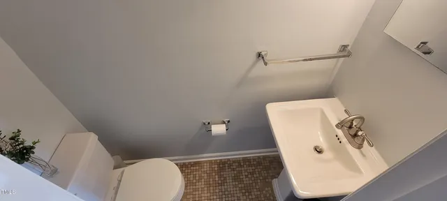 a bathroom with a toilet and a sink