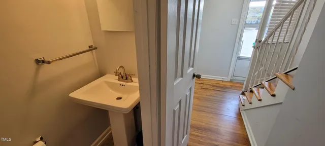 a bathroom with a sink a mirror and shower