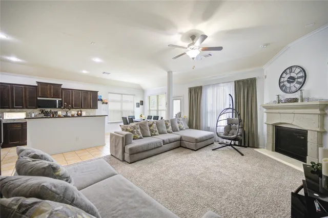 a living room with furniture and a fireplace