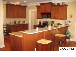827 Village Road Charlottesville, VA 22903 - Photo 5 of 11 Kitchen - breakfast bar, maple cabinets, granite counters, pantry.