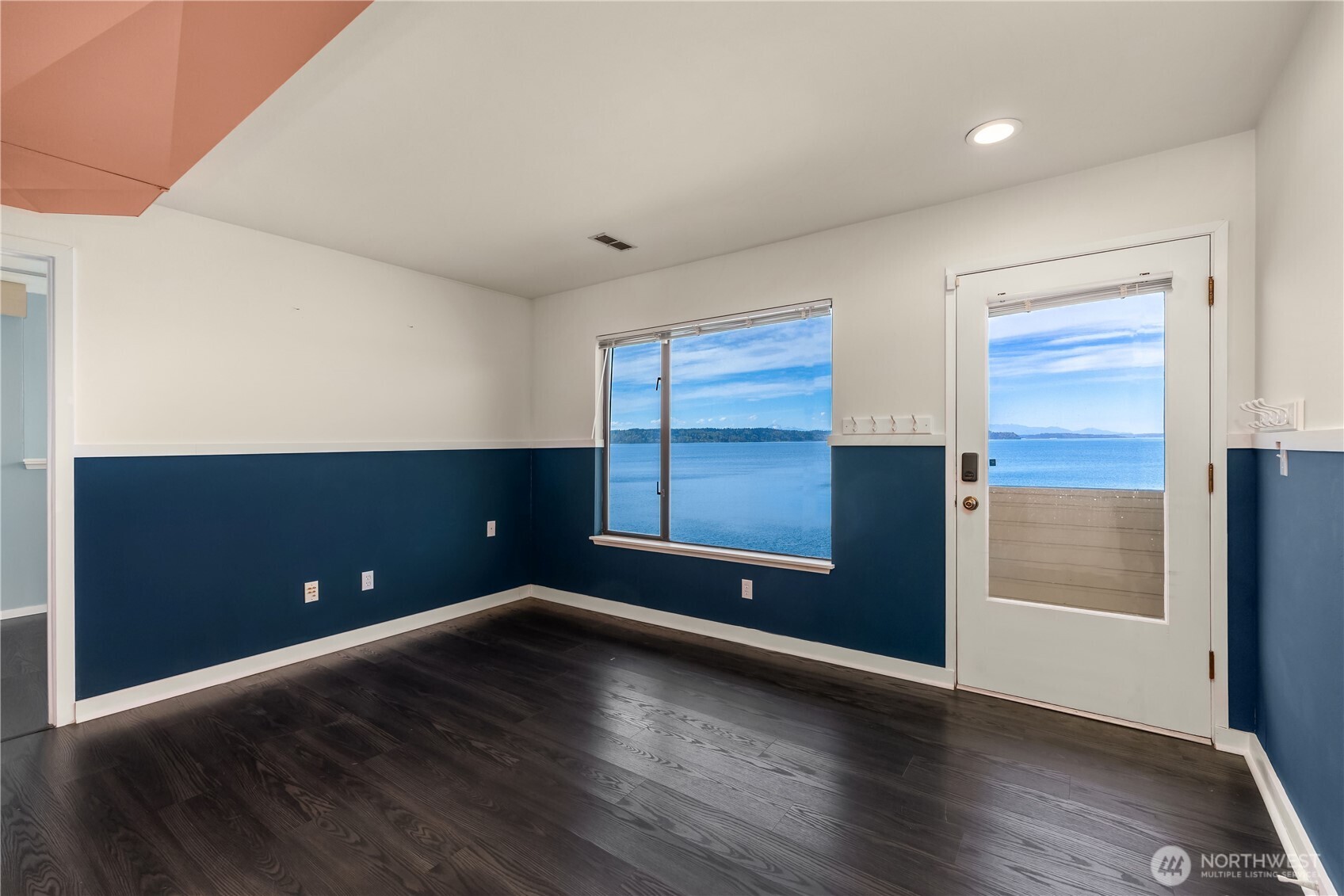 16611 Maplewild Avenue Southwest Burien, WA 98166 - Photo 12 of 40 an empty room with wooden floor and windows