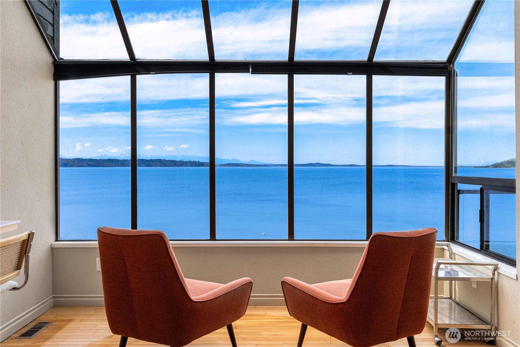 16611 Maplewild Avenue Southwest Burien, WA 98166 - Photo 14 of 40 a blue chair sitting in front of a window