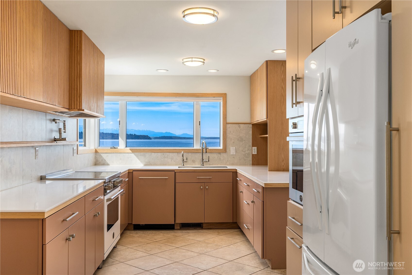 16611 Maplewild Avenue Southwest Burien, WA 98166 - Photo 19 of 40 a kitchen with a sink stove and refrigerator