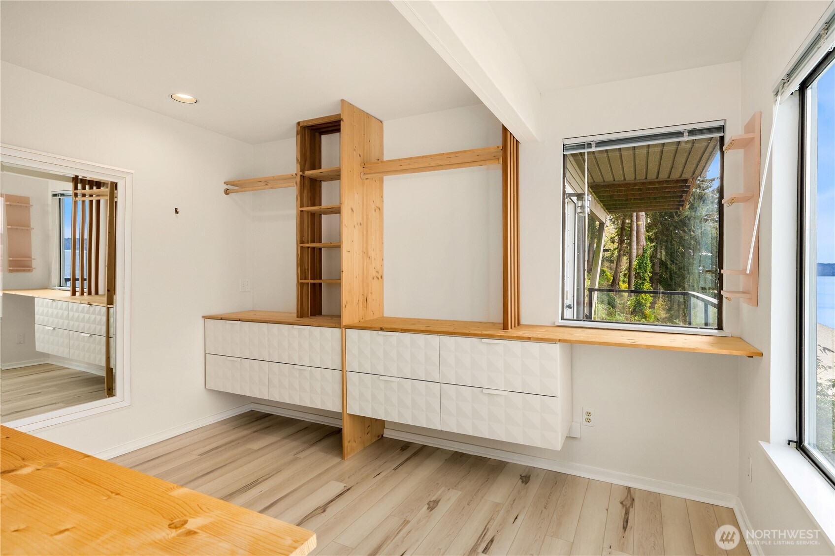 16611 Maplewild Avenue Southwest Burien, WA 98166 - Photo 23 of 40 a view of a bedroom with wooden floor and windows