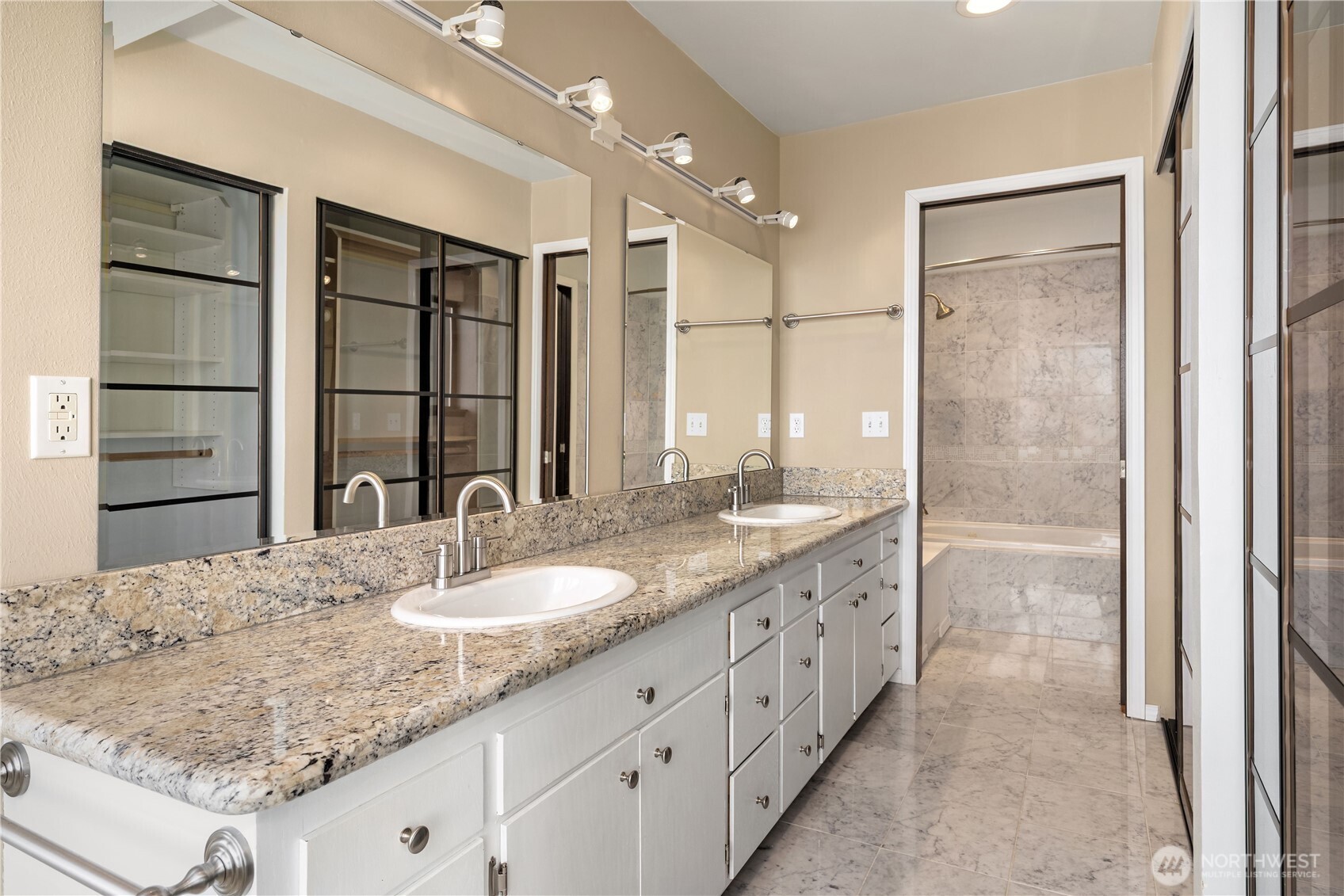 16611 Maplewild Avenue Southwest Burien, WA 98166 - Photo 25 of 40 a bathroom with a granite countertop sink mirror and shower