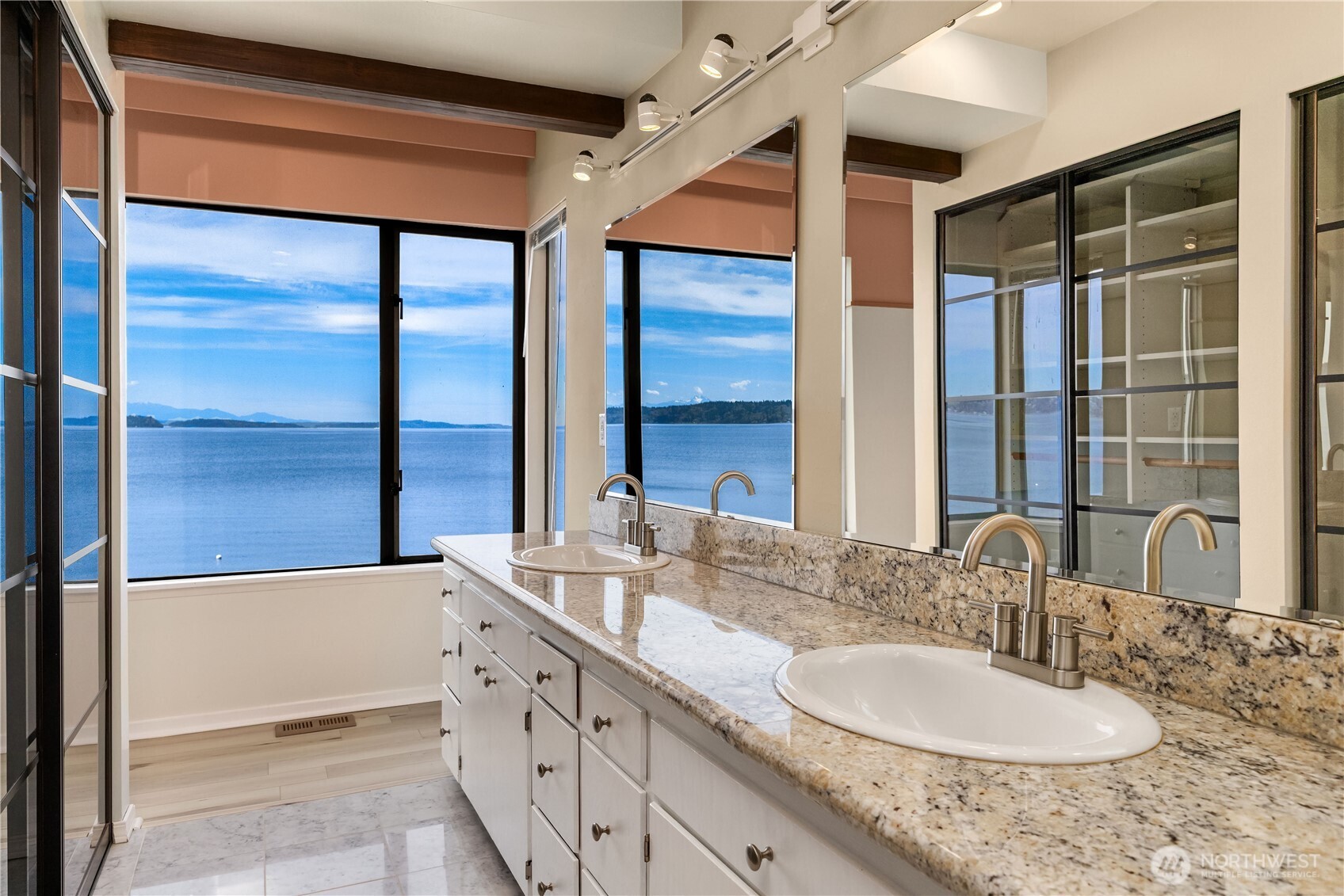 16611 Maplewild Avenue Southwest Burien, WA 98166 - Photo 26 of 40 a bathroom with a double vanity sink and a mirror