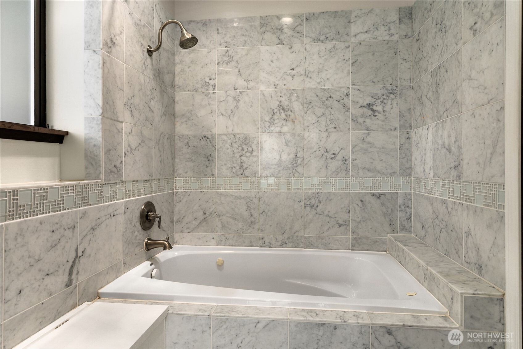 16611 Maplewild Avenue Southwest Burien, WA 98166 - Photo 27 of 40 a bath tub sitting next to a white sink and vanity