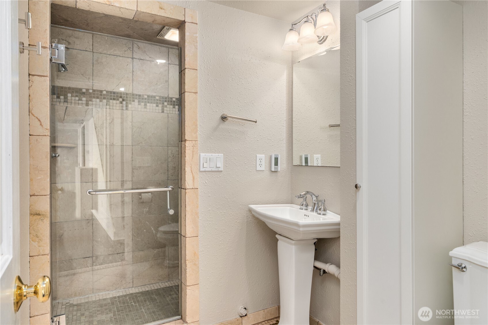 16611 Maplewild Avenue Southwest Burien, WA 98166 - Photo 29 of 40 a bathroom with a sink mirror and shower