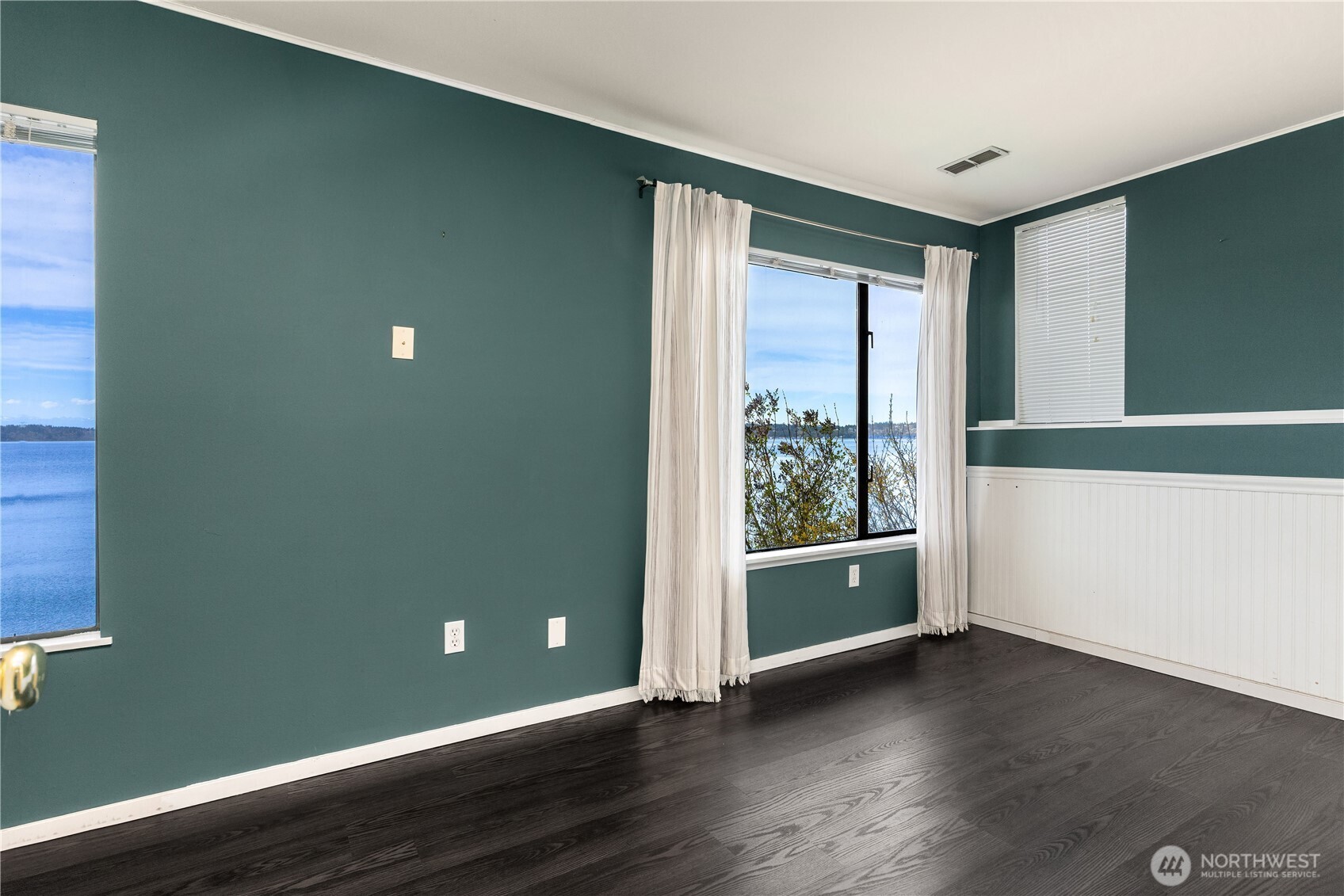 16611 Maplewild Avenue Southwest Burien, WA 98166 - Photo 30 of 40 an empty room with wooden floor and windows