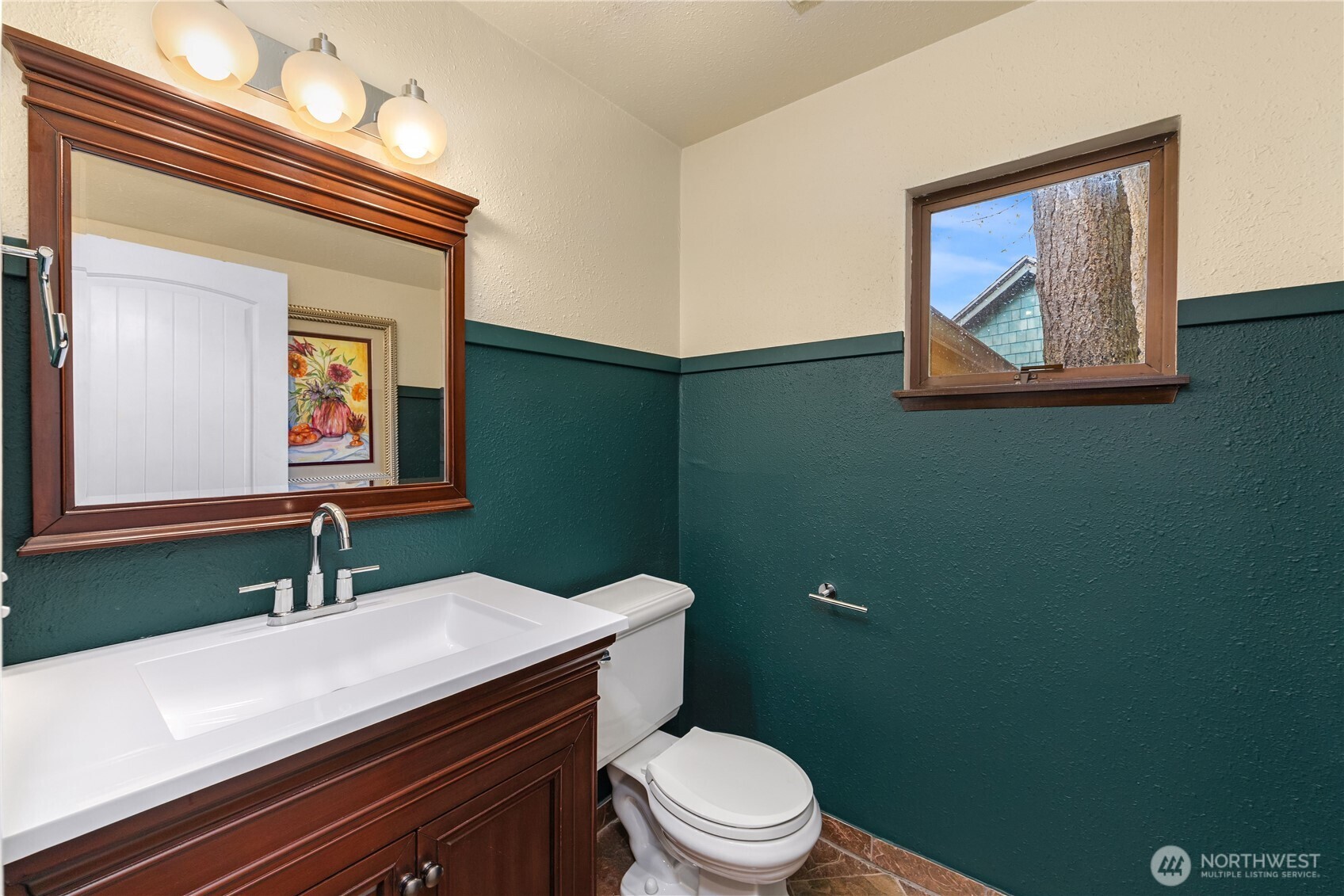 16611 Maplewild Avenue Southwest Burien, WA 98166 - Photo 32 of 40 a bathroom with a toilet a sink and mirror