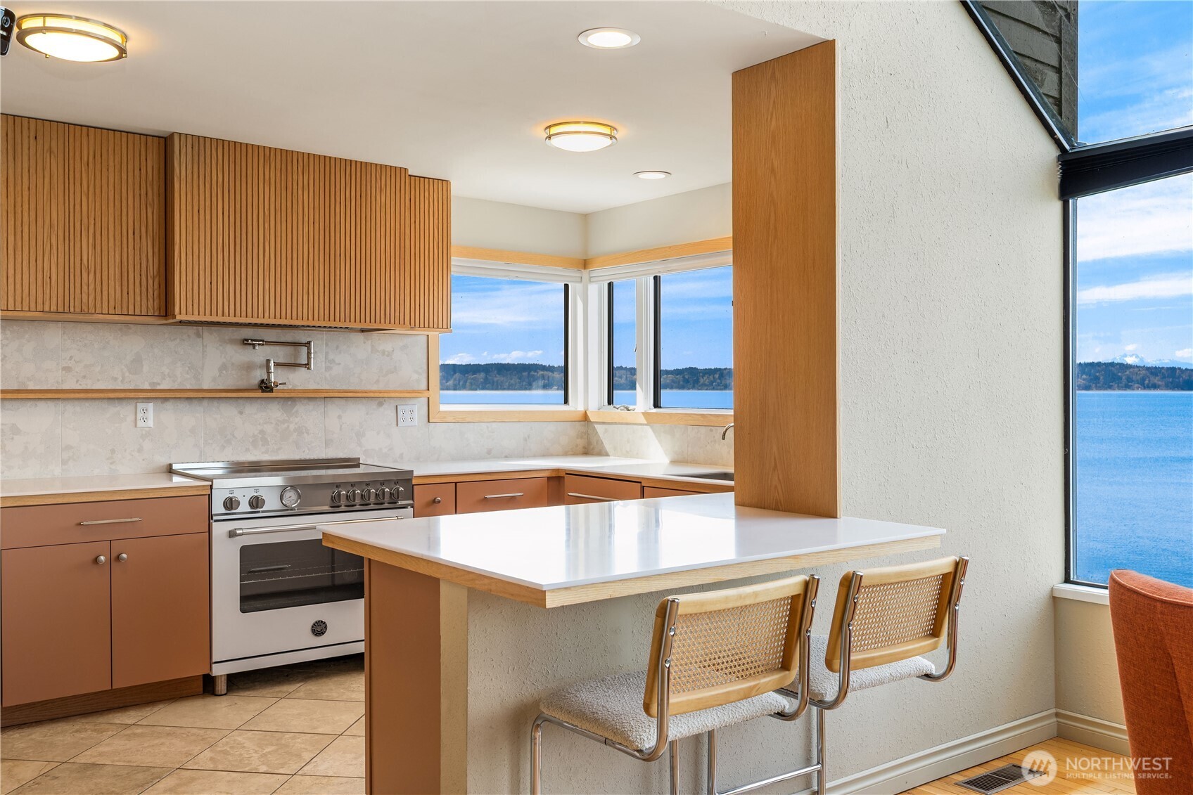 16611 Maplewild Avenue Southwest Burien, WA 98166 - Photo 37 of 40 a kitchen with table chairs sink and cabinets