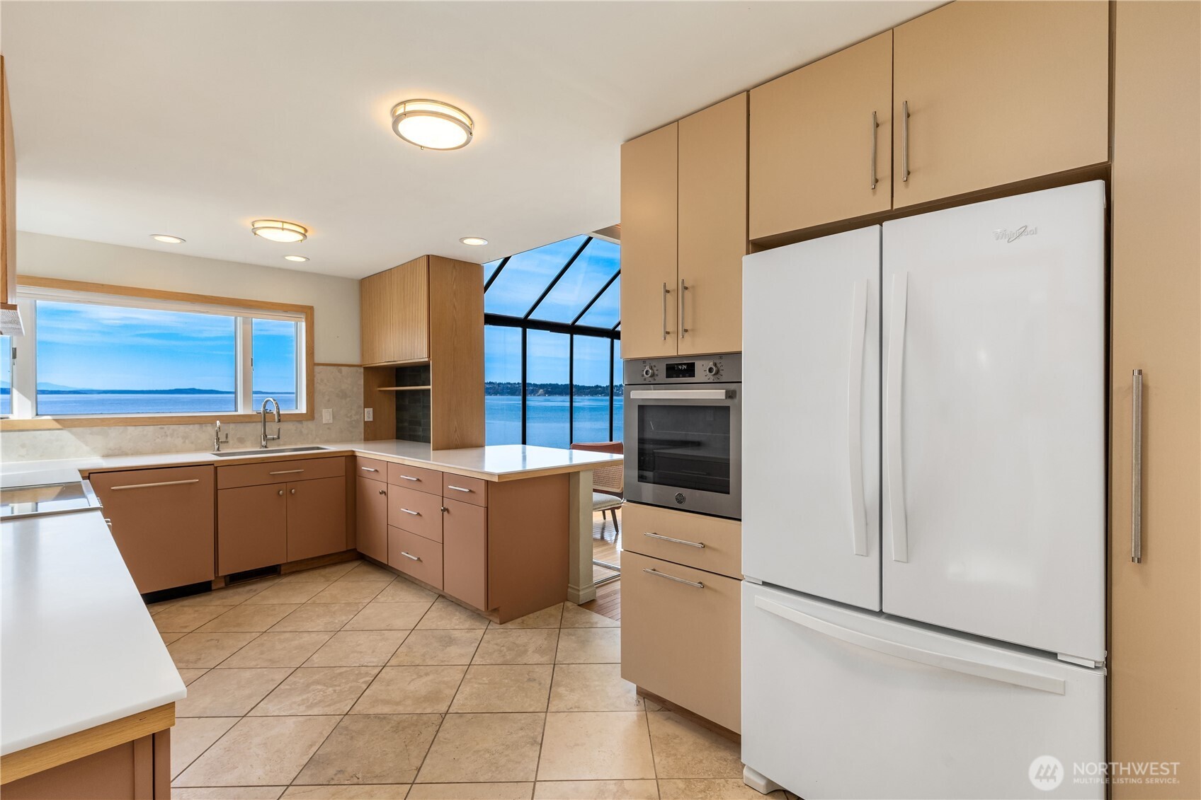 16611 Maplewild Avenue Southwest Burien, WA 98166 - Photo 39 of 40 a kitchen with a refrigerator and a sink
