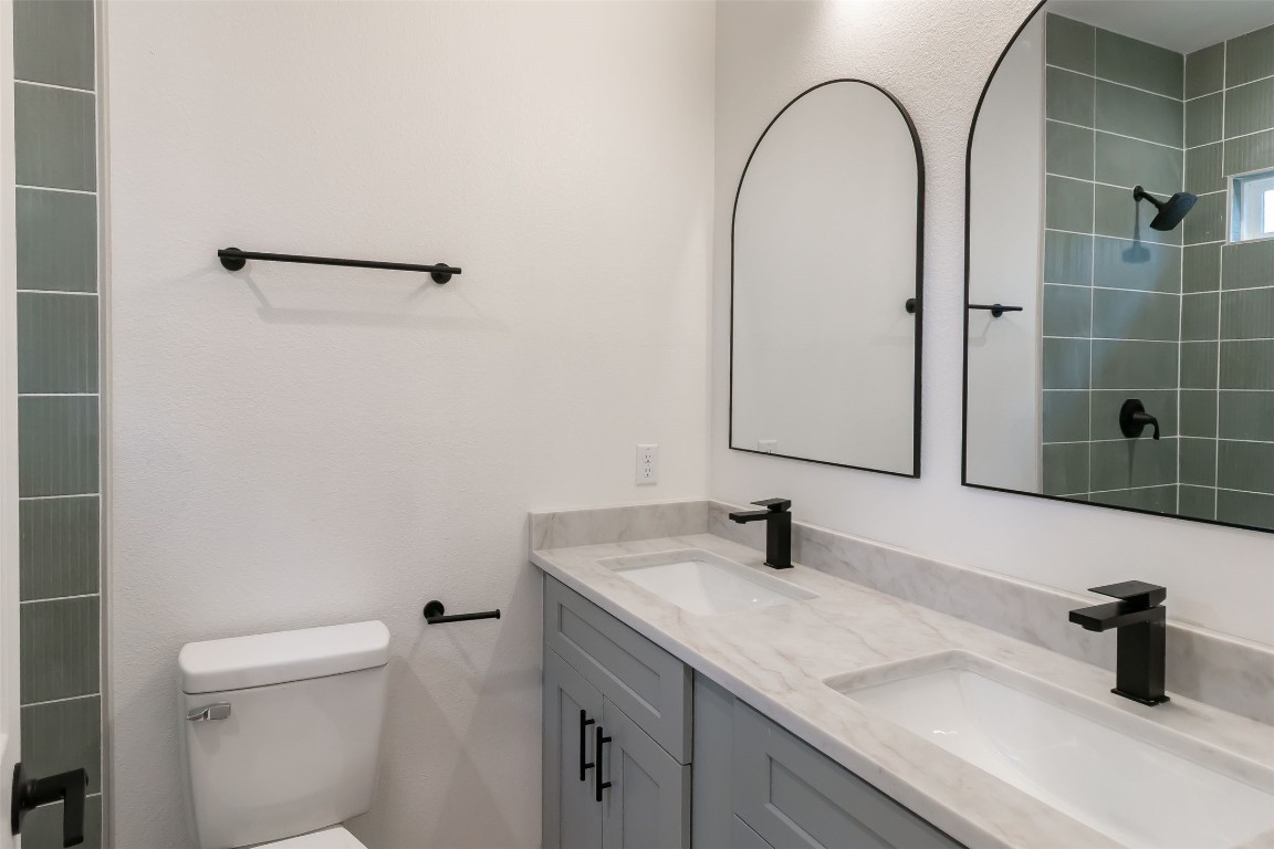 508 Brown Street Lockhart, TX 78644 - Photo 13 of 18 a bathroom with a sink and a mirror