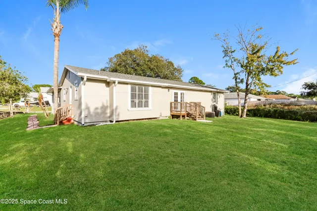 a view of storage and utility room with window