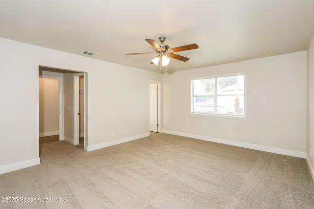 a bathroom with a double vanity sink and mirror