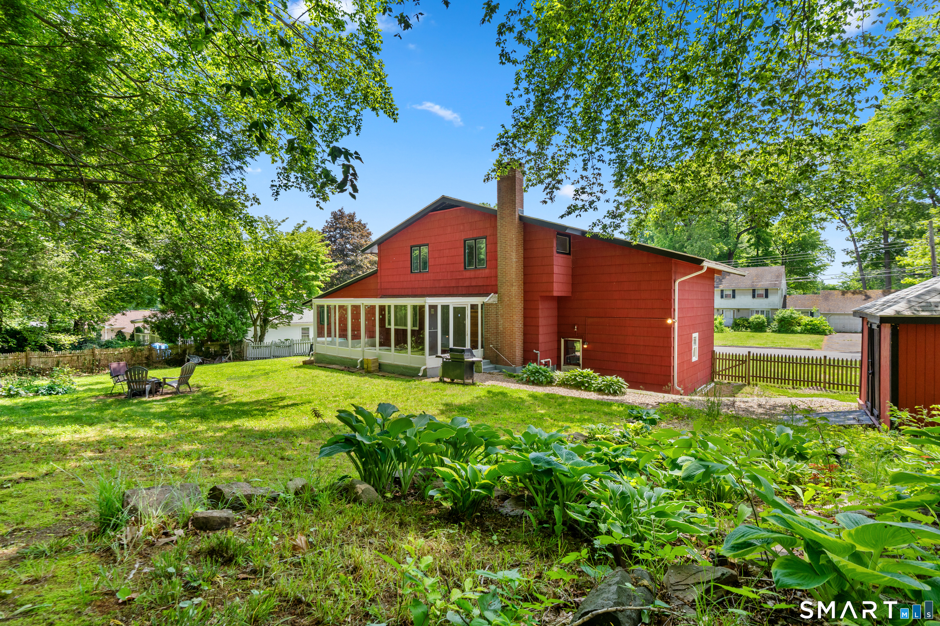 107 Round Hill Road Wethersfield, CT 06109 - Photo 35 of 40 a front view of a house with garden