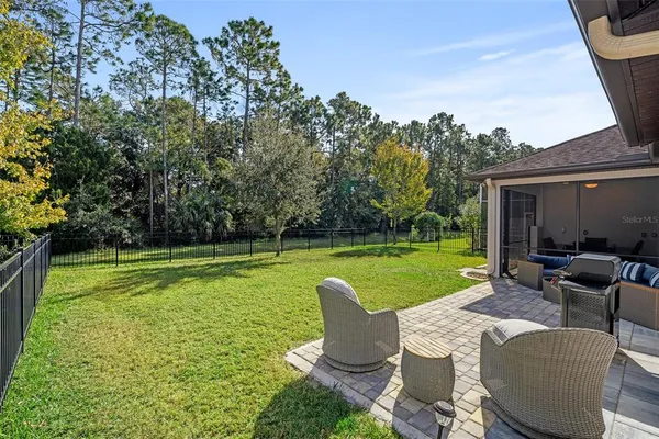 a view of a swimming pool and lounge chair