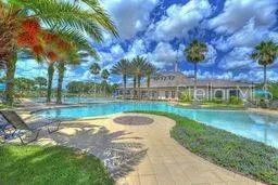 a view of swimming pool with a yard