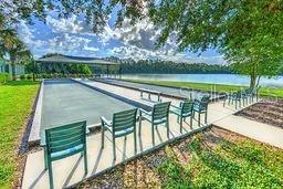 a view of swimming pool with a patio and a yard