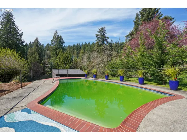 a view of a swimming pool with an outdoor space and seating area