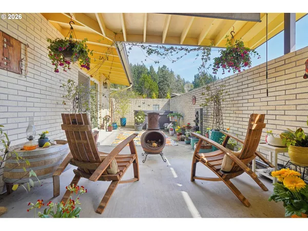 a balcony with table and chairs