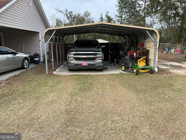 a view of car parked in parking lot of house