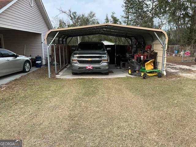 a view of car parked in parking lot of house
