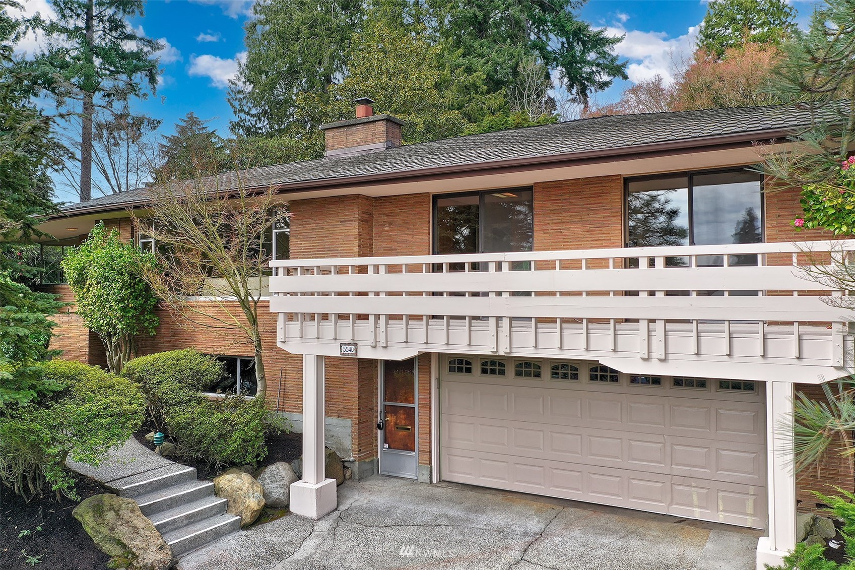 5540 Northeast Windermere Road Seattle, WA 98105 - Photo 1 of 40 a view of a house with a balcony