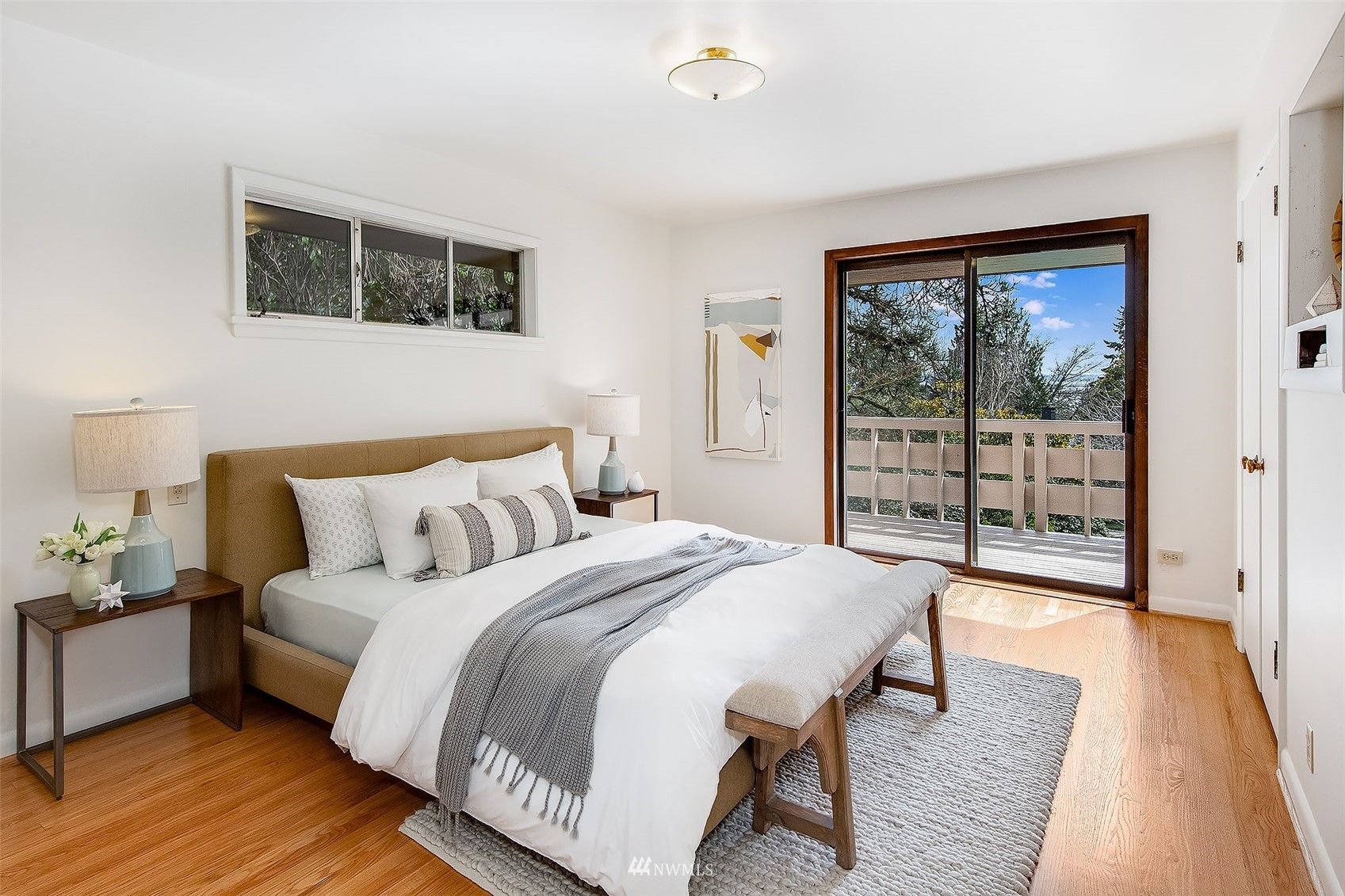 5540 Northeast Windermere Road Seattle, WA 98105 - Photo 11 of 40 a bedroom with a bed and a large window