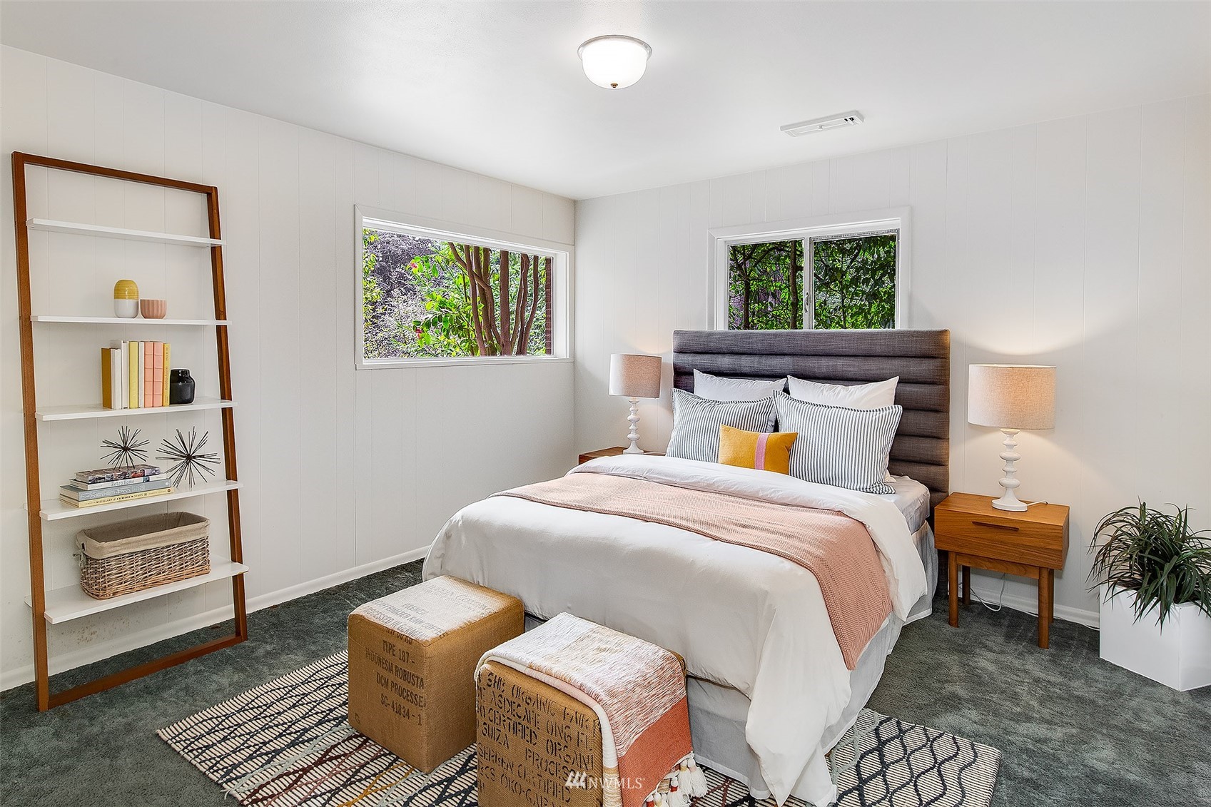5540 Northeast Windermere Road Seattle, WA 98105 - Photo 20 of 40 a bedroom with a bed and wooden floor