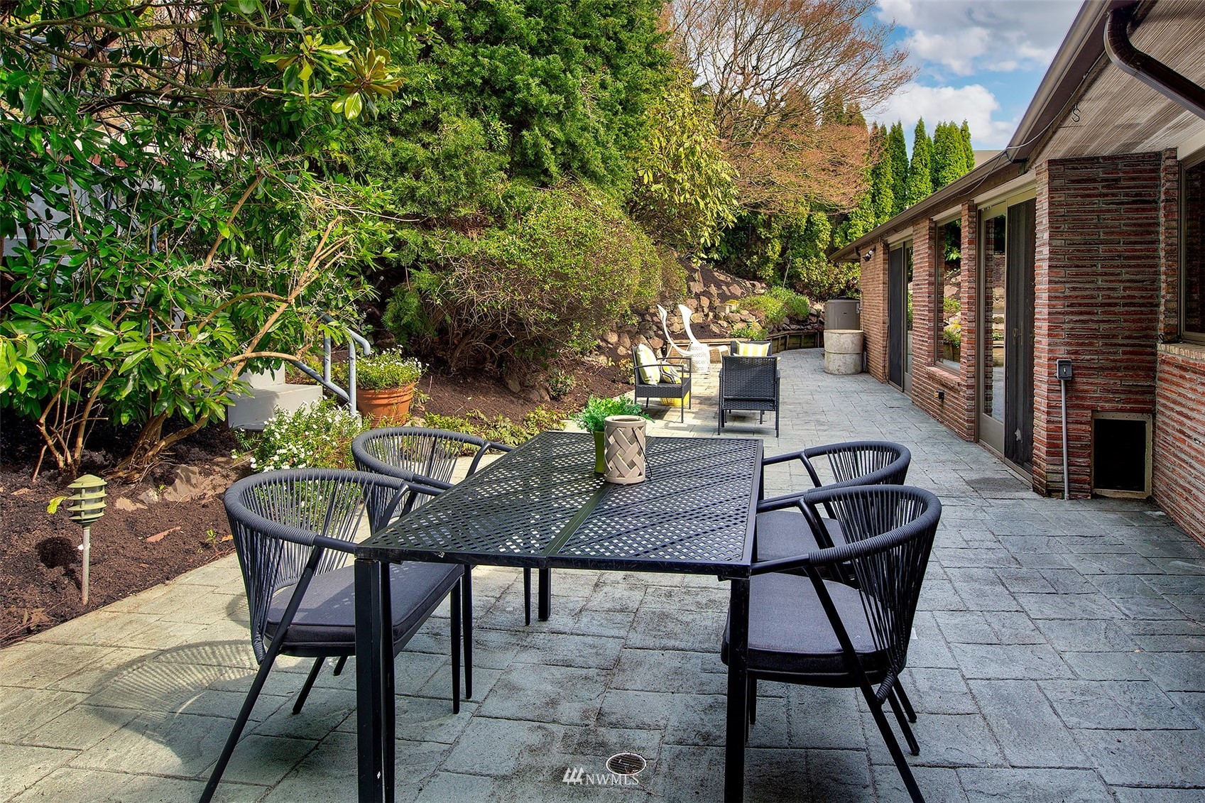5540 Northeast Windermere Road Seattle, WA 98105 - Photo 25 of 40 a backyard of a house with table and chairs