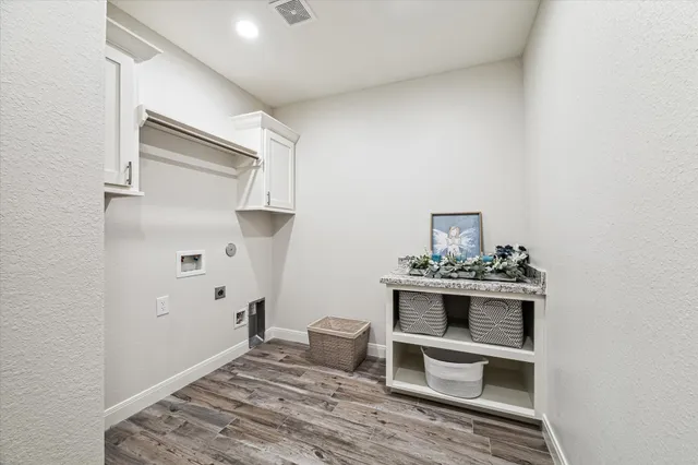 a bedroom with furniture and a chandelier