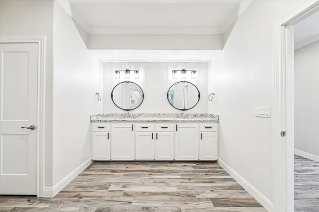 a view of closet with wooden floor