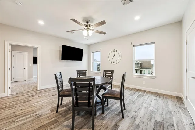 a spacious bedroom with a bed and a chandelier