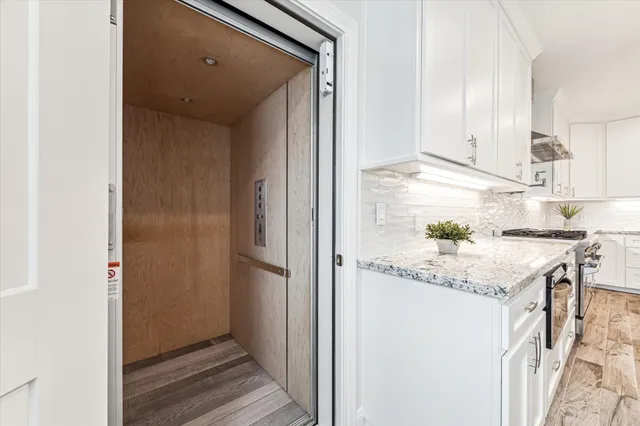 a view of a house with wooden deck