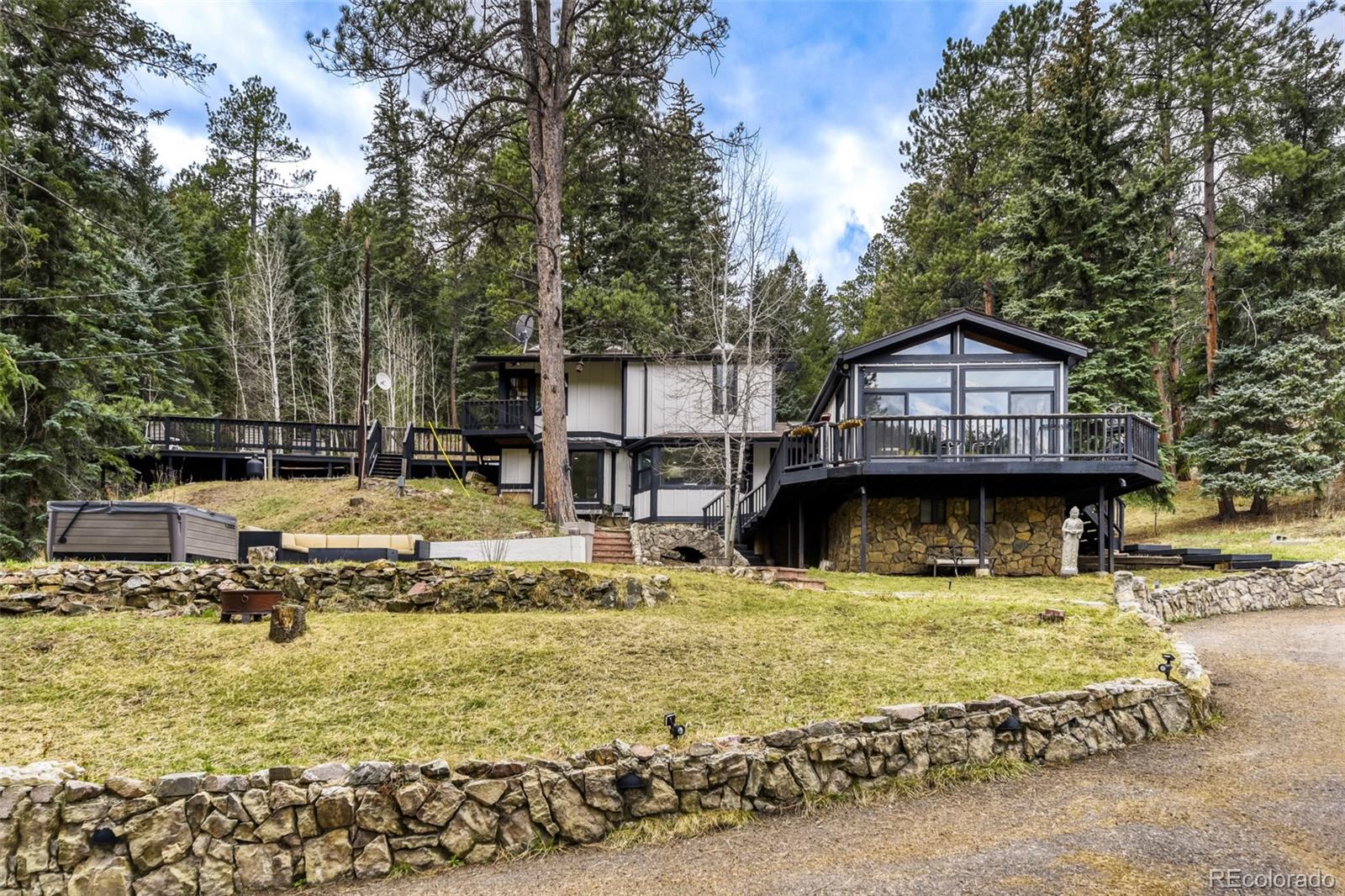 7489 South Turkey Creek Road Morrison, CO 80465 - Photo 28 of 28 a view of a house with swimming pool