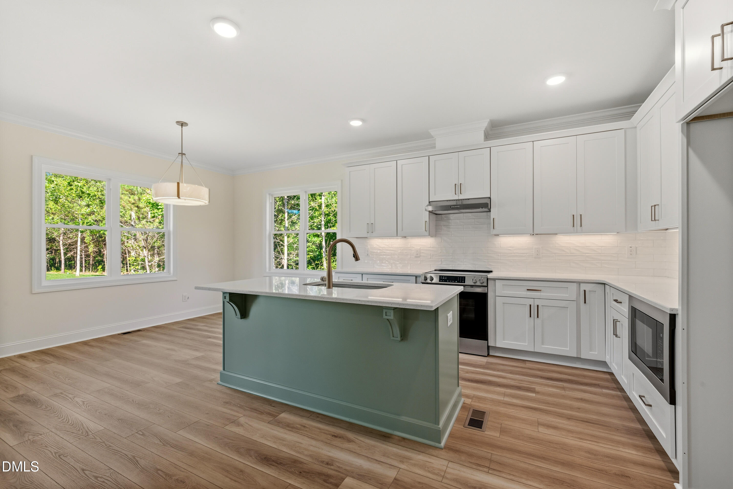 2251 Peachtree Hills Road Spring Hope, NC 27882 - Photo 11 of 46 a kitchen with stainless steel appliances granite countertop a sink a stove and a wooden floors